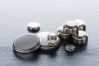 Close up of several button batteries.